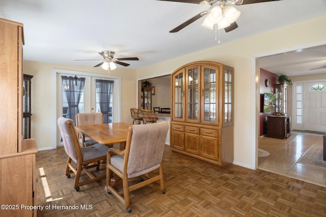 9414 Northcliffe Blvd, Spring Hill, FL 34606 - dining space with a textured ceiling, baseboards, and a ceiling fan
