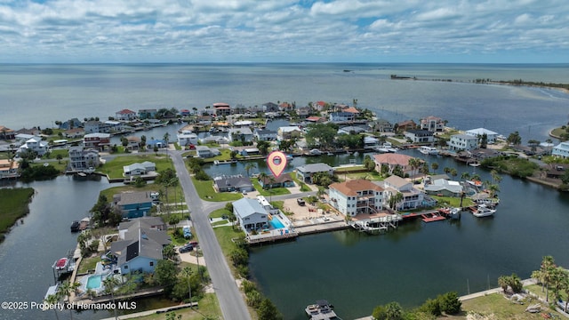 bird's eye view featuring a water view and a residential view