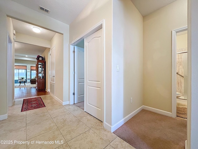 5401 Cappleman Loop, Brooksville, FL 34601 - corridor with baseboards and light tile patterned floors
