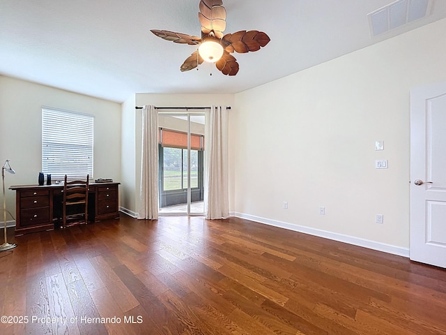 5401 Cappleman Loop, Brooksville, FL 34601 - interior space with dark wood-style flooring, a ceiling fan, baseboards, and an office area