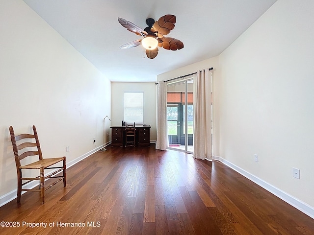 5401 Cappleman Loop, Brooksville, FL 34601 - sitting room featuring dark wood-type flooring, a ceiling fan, and baseboards