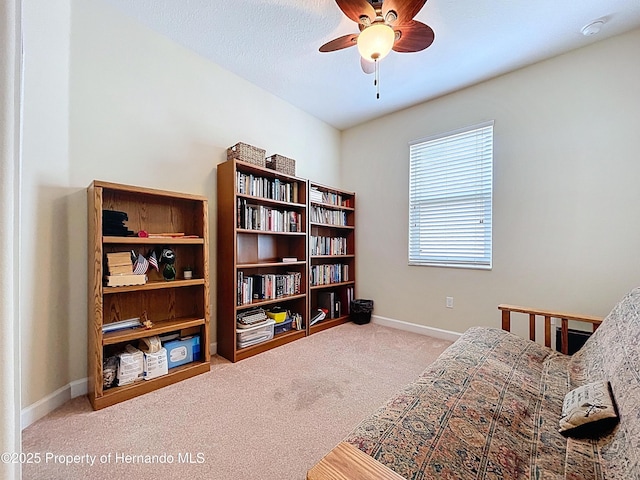 5401 Cappleman Loop, Brooksville, FL 34601 - living area with carpet, a ceiling fan, and baseboards