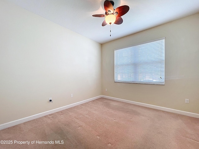 5401 Cappleman Loop, Brooksville, FL 34601 - empty room featuring ceiling fan, light carpet, and baseboards