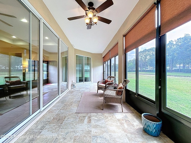 5401 Cappleman Loop, Brooksville, FL 34601 - sunroom / solarium with a ceiling fan, stone tile floors, and lofted ceiling