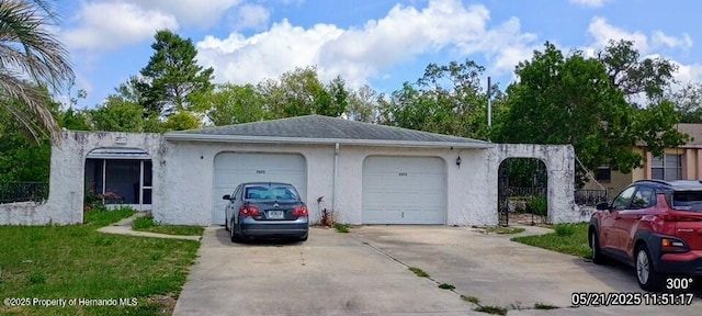 7371 Canterbury St, Spring Hill, FL 34606 - view of front facade featuring driveway, a garage, and stucco siding
