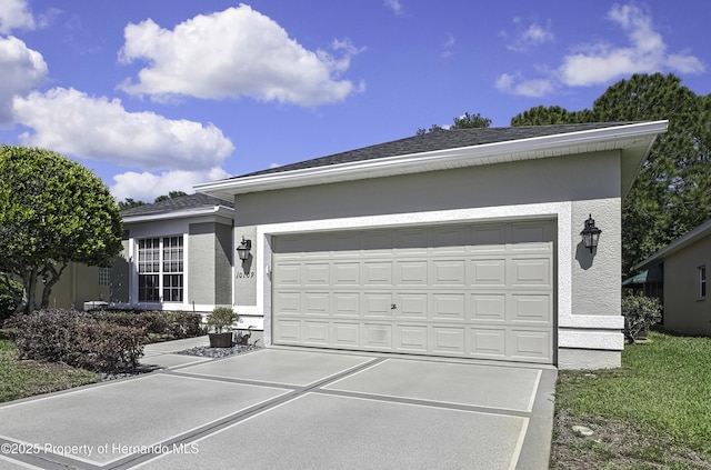10109 Holly Berry Dr, Weeki Wachee, FL 34613 - view of front facade with an attached garage, driveway, and stucco siding
