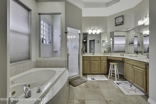 10109 Holly Berry Dr, Weeki Wachee, FL 34613 - full bath with a sink, a shower stall, double vanity, and a garden tub