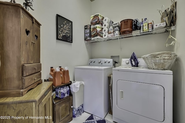 10109 Holly Berry Dr, Weeki Wachee, FL 34613 - clothes washing area with washing machine and clothes dryer and cabinet space