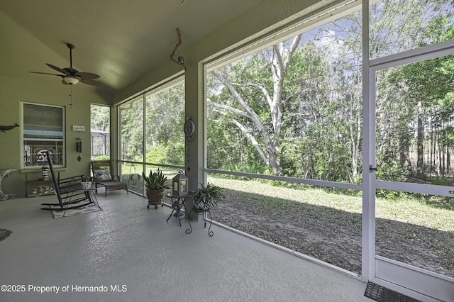 10109 Holly Berry Dr, Weeki Wachee, FL 34613 - sunroom / solarium featuring a ceiling fan