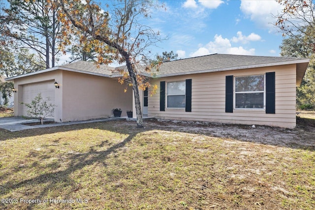 12575 Maleo Rd, Weeki Wachee, FL 34614 - ranch-style house with a garage and a front lawn