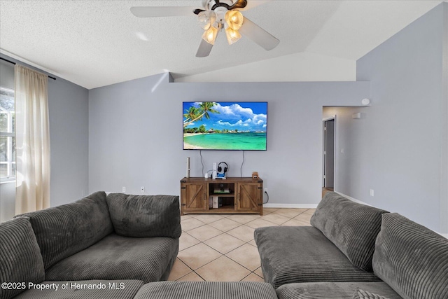 12575 Maleo Rd, Weeki Wachee, FL 34614 - living area with light tile patterned floors, lofted ceiling, ceiling fan, and baseboards
