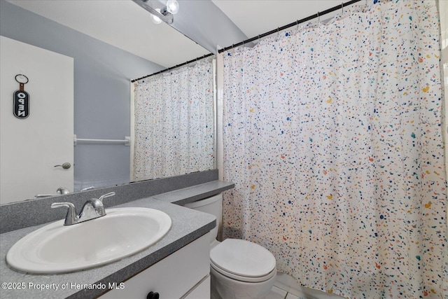 12575 Maleo Rd, Weeki Wachee, FL 34614 - bathroom featuring toilet, a shower with shower curtain, tile patterned floors, and vanity