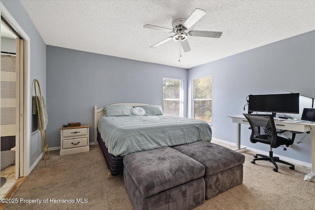 12575 Maleo Rd, Weeki Wachee, FL 34614 - bedroom featuring a textured ceiling, carpet flooring, a desk, a ceiling fan, and baseboards
