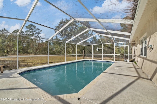 12575 Maleo Rd, Weeki Wachee, FL 34614 - outdoor pool featuring a patio and glass enclosure