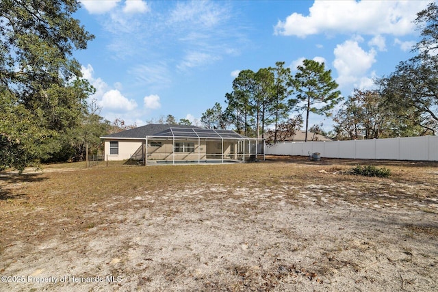 12575 Maleo Rd, Weeki Wachee, FL 34614 - back of house with fence and a lanai