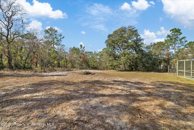 12575 Maleo Rd, Weeki Wachee, FL 34614 - view of yard with a sunroom
