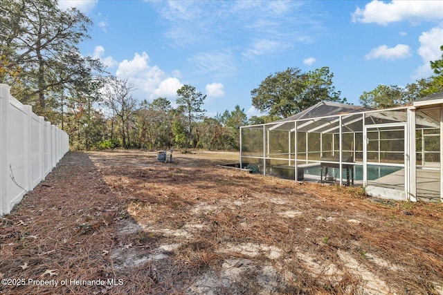 12575 Maleo Rd, Weeki Wachee, FL 34614 - view of yard featuring an outdoor pool, fence, and a lanai