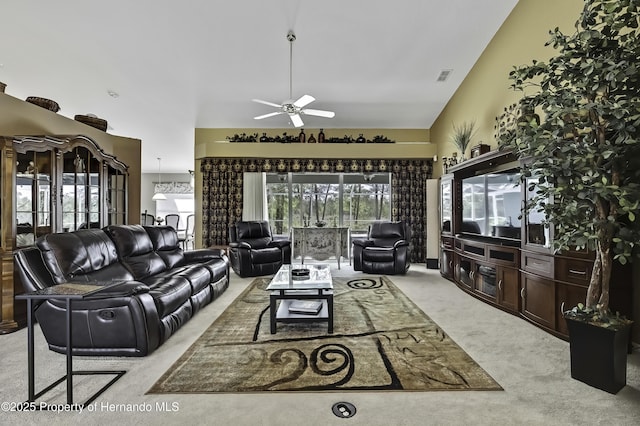 17364 Mediterranean Cir, Brooksville, FL 34614 - living area with light colored carpet, high vaulted ceiling, ceiling fan, and visible vents