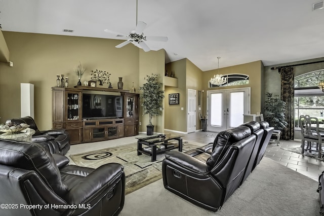 17364 Mediterranean Cir, Brooksville, FL 34614 - living area with high vaulted ceiling, french doors, ceiling fan with notable chandelier, and visible vents