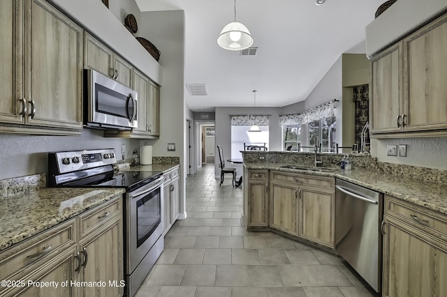 17364 Mediterranean Cir, Brooksville, FL 34614 - kitchen with appliances with stainless steel finishes, light tile patterned floors, lofted ceiling, and visible vents
