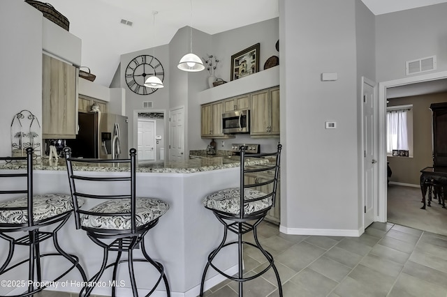 17364 Mediterranean Cir, Brooksville, FL 34614 - kitchen featuring appliances with stainless steel finishes, high vaulted ceiling, baseboards, and visible vents