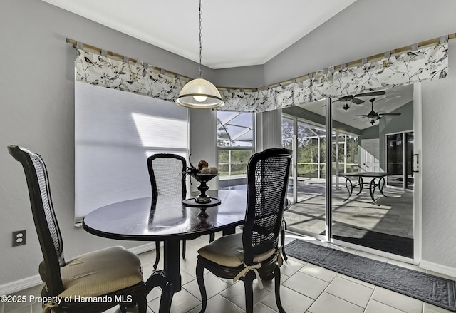 17364 Mediterranean Cir, Brooksville, FL 34614 - tiled dining space featuring ceiling fan, baseboards, and vaulted ceiling