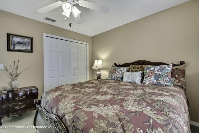 17364 Mediterranean Cir, Brooksville, FL 34614 - bedroom featuring visible vents, ceiling fan, a closet, and carpet floors