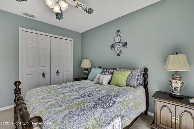 17364 Mediterranean Cir, Brooksville, FL 34614 - bedroom featuring a closet, baseboards, a ceiling fan, carpet floors, and visible vents