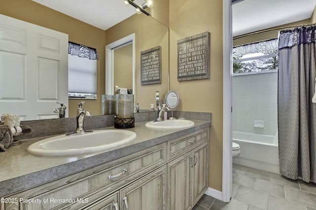 17364 Mediterranean Cir, Brooksville, FL 34614 - bathroom featuring tile patterned flooring, double vanity, a sink, and toilet