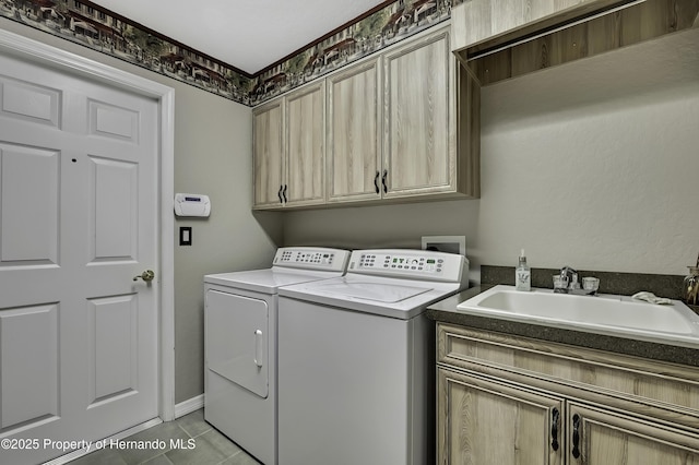 17364 Mediterranean Cir, Brooksville, FL 34614 - laundry area featuring light tile patterned floors, independent washer and dryer, a sink, and cabinet space