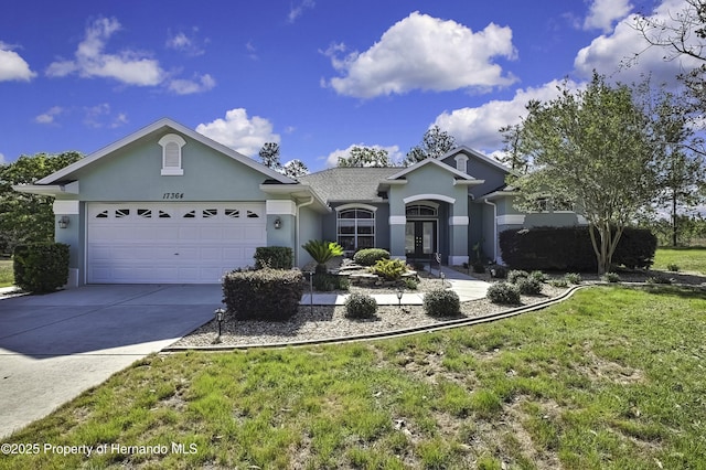 17364 Mediterranean Cir, Brooksville, FL 34614 - ranch-style home with an attached garage, driveway, and stucco siding