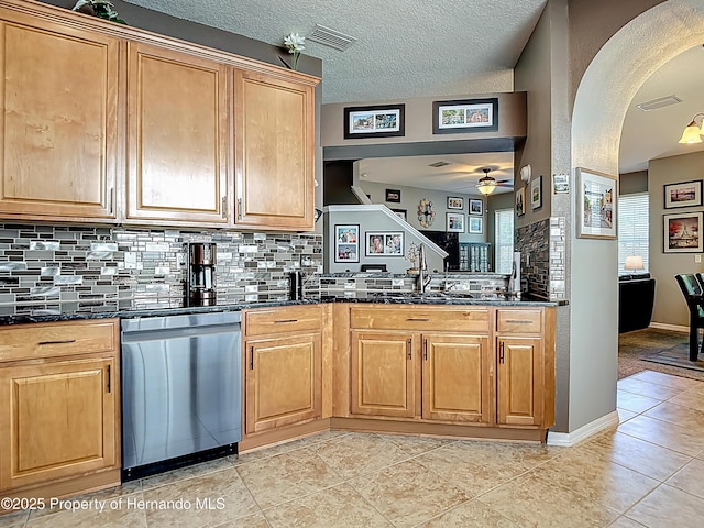 kitchen with tasteful backsplash, visible vents, ceiling fan, and dishwasher