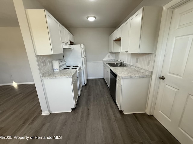 kitchen featuring white electric range oven, stainless steel dishwasher, a sink, and dark wood-style floors