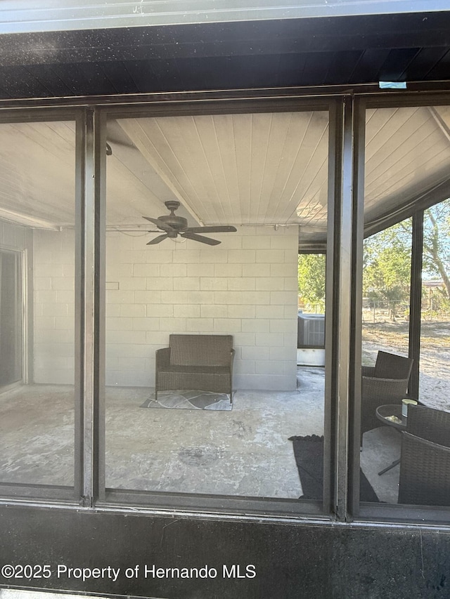 view of patio featuring ceiling fan