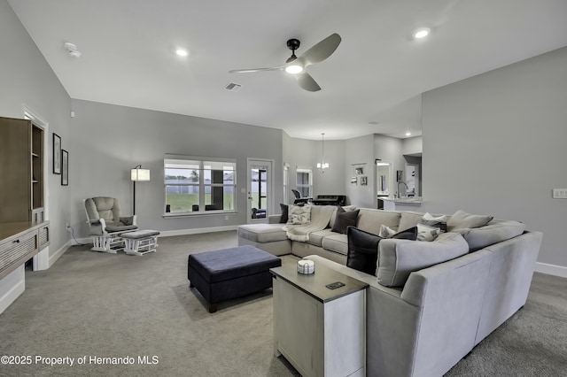 12848 Hilary St, Spring Hill, FL 34609 - living room with visible vents, baseboards, ceiling fan, recessed lighting, and light colored carpet
