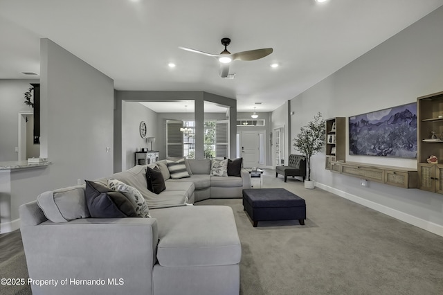12848 Hilary St, Spring Hill, FL 34609 - living room with recessed lighting, ceiling fan with notable chandelier, baseboards, and carpet floors