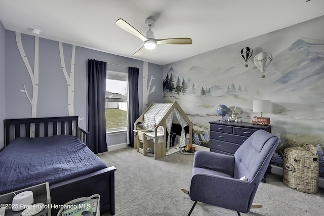 12848 Hilary St, Spring Hill, FL 34609 - bedroom featuring light carpet, baseboards, and a ceiling fan