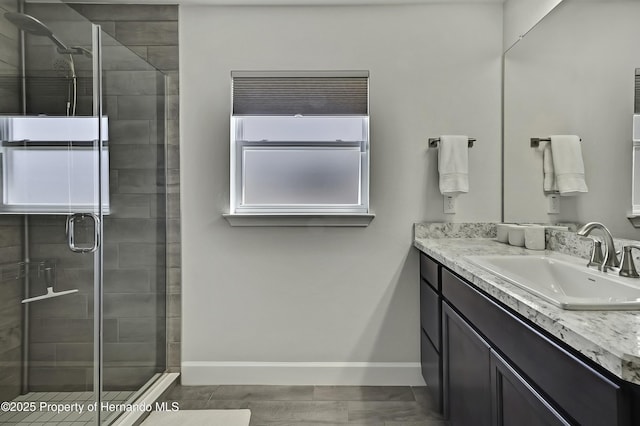 12848 Hilary St, Spring Hill, FL 34609 - full bathroom featuring baseboards, a stall shower, and vanity