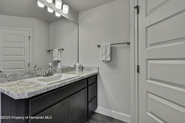 12848 Hilary St, Spring Hill, FL 34609 - bathroom featuring baseboards and vanity
