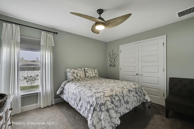 12848 Hilary St, Spring Hill, FL 34609 - carpeted bedroom featuring a closet, baseboards, a ceiling fan, and visible vents