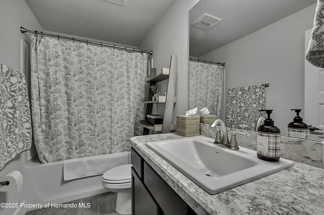 12848 Hilary St, Spring Hill, FL 34609 - bathroom featuring toilet, vanity, a shower with shower curtain, and visible vents