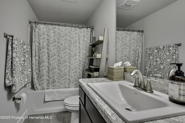 12848 Hilary St, Spring Hill, FL 34609 - full bath featuring visible vents, toilet, shower / tub combo, and vanity
