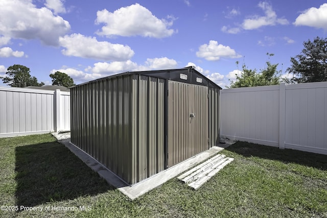 12848 Hilary St, Spring Hill, FL 34609 - view of shed featuring a fenced backyard