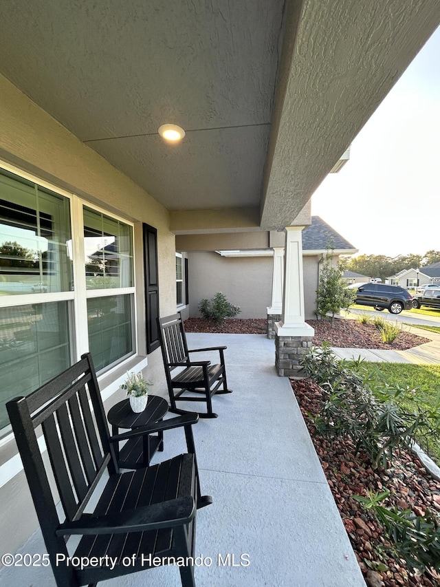 12848 Hilary St, Spring Hill, FL 34609 - view of patio / terrace featuring covered porch