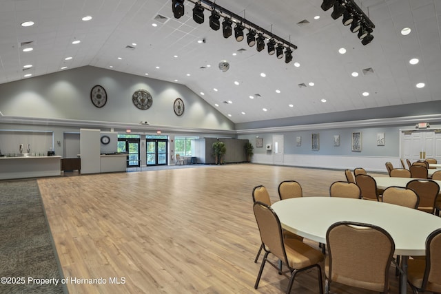 11250 Hollander Ave, Hudson, FL 34667 - dining area with recessed lighting, wood finished floors, visible vents, and high vaulted ceiling