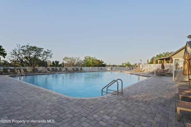 11250 Hollander Ave, Hudson, FL 34667 - community pool with a patio and fence