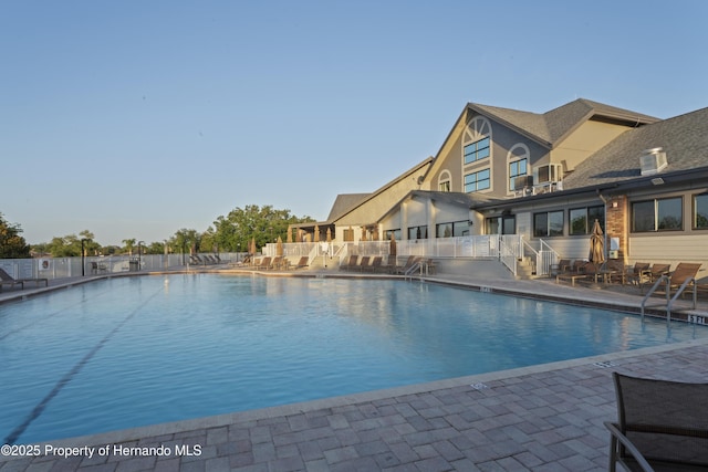 11250 Hollander Ave, Hudson, FL 34667 - community pool with fence and a patio area