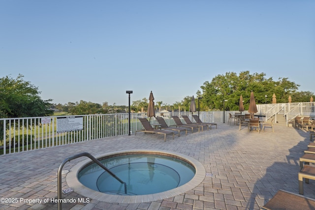 11250 Hollander Ave, Hudson, FL 34667 - view of pool with a patio, fence, and a community hot tub