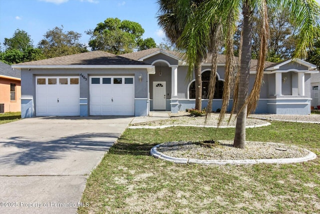 4405 Plumosa St, Spring Hill, FL 34607 - ranch-style home featuring a garage, driveway, a front lawn, and stucco siding