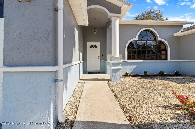 4405 Plumosa St, Spring Hill, FL 34607 - entrance to property featuring stucco siding